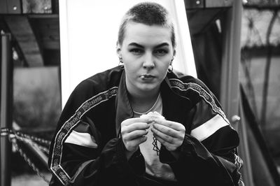 Portrait of young man smoking