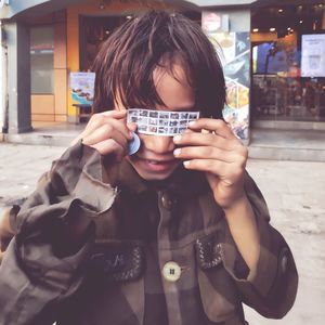 Portrait of man holding camera