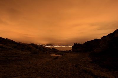 Scenic view of beach against sky during sunset