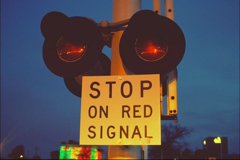 communication, text, illuminated, western script, low angle view, guidance, information sign, sign, lighting equipment, road sign, sky, information, blue, capital letter, night, built structure, dusk, non-western script, street light, architecture