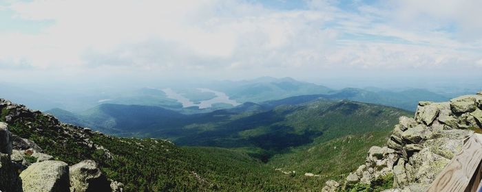 Panoramic view of mountains and sea against sky