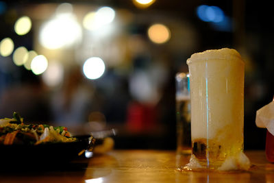 Close-up of wine glass on table at restaurant