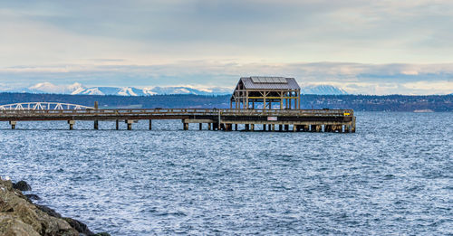 Pier over sea against sky