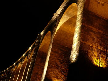 Low angle view of historical building against sky at night