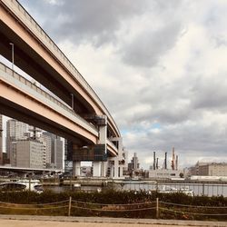 Low angle view of train against buildings in city