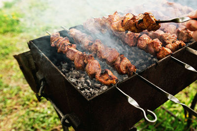 High angle view of meat on barbecue grill