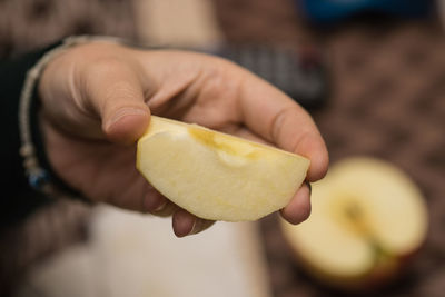 Close-up of hand holding apple