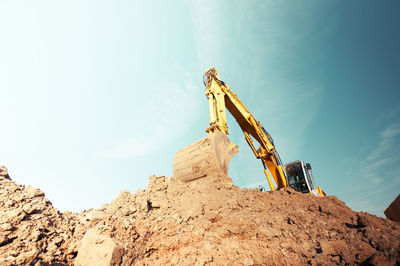 Low angle view of rock formations against sky