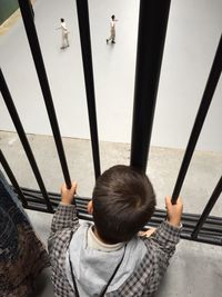 High angle view of boy sitting on floor