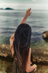 Rear view of woman in sea