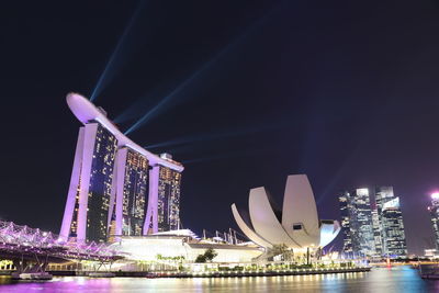 Illuminated modern buildings in city at night