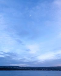 Scenic view of sea against sky at dusk