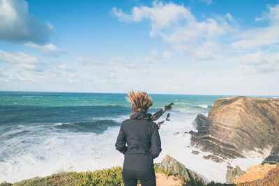 Rear view of woman on beach