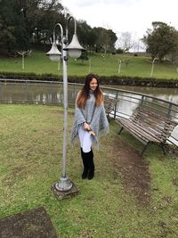 Full length of young woman in park