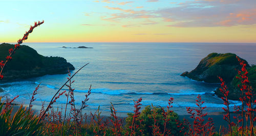 Scenic view of sea against sky during sunset