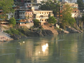 High angle view of buildings with reflection in water