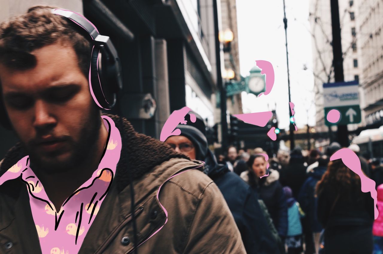 lifestyles, leisure activity, focus on foreground, men, headshot, celebration, large group of people, holding, front view, standing, street, communication, casual clothing, togetherness, close-up, city, head and shoulders, person