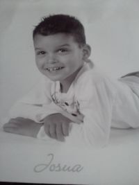 Portrait of cute boy smiling at home