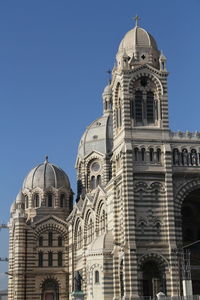 Low angle view of church against blue sky