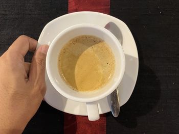 High angle view of coffee cup on table