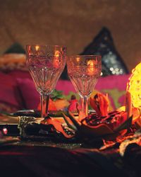 Close-up of wine glasses on table