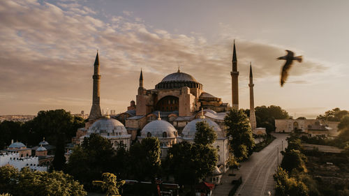 Panoramic view of buildings against sky during sunset