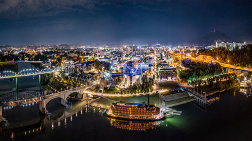 High angle view of illuminated buildings in city at night