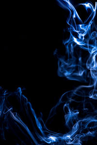 Close-up of smoke against black background