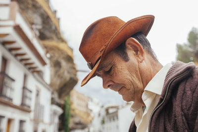 Portrait of man wearing hat