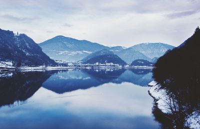 Scenic view of lake with mountains in background