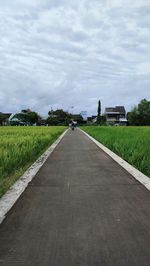 Empty road against sky