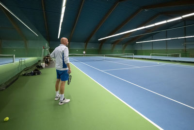 Man at tennis court