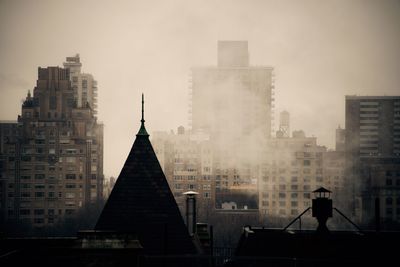 Buildings in city at dusk