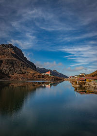 Pristine lake surrounded by himalayan mountain with pristine water reflection isolated view