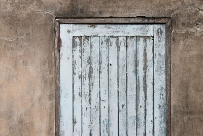 Close-up of old wooden door of building