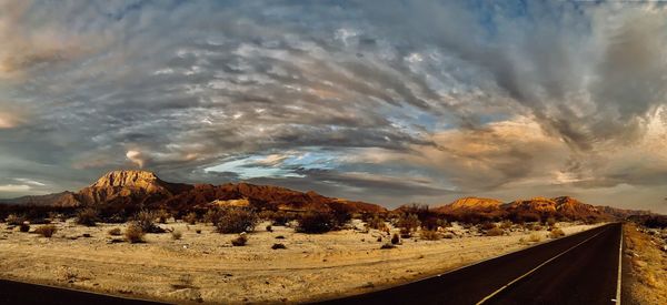 Road by land against sky