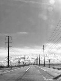 Empty road against sky