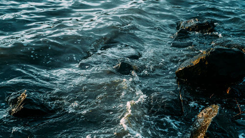 High angle view of rocks in sea