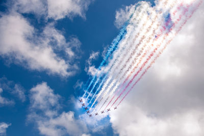 Low angle view of airshow in sky