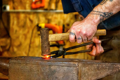 Man working on anvil in the forge