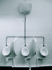 Toilet bowls attached on wall