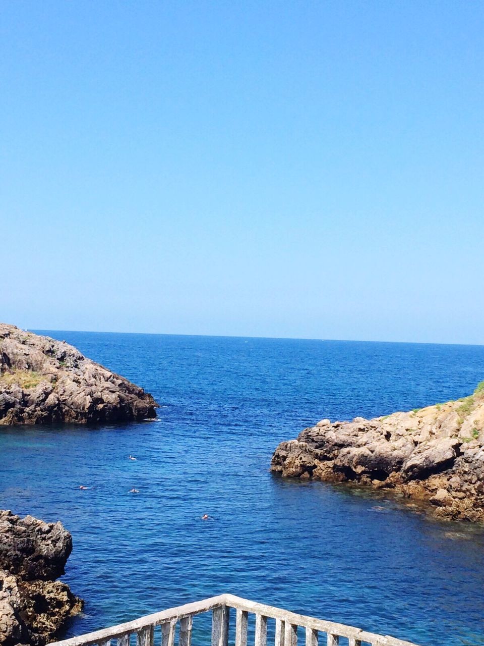 sea, water, horizon over water, blue, copy space, scenics, tranquil scene, clear sky, tranquility, rock - object, beauty in nature, rock formation, idyllic, seascape, non-urban scene, calm, nature, geology, cliff, day, vacations, majestic, outdoors, tourism, summer, eroded, no people, mountain, rocky mountains, physical geography, rocky, remote, waterfront