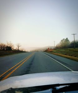 Empty road passing through landscape