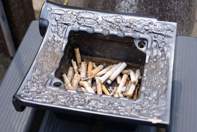 High angle view of cigarette in container