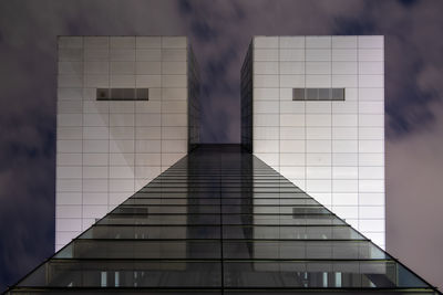 Digital composite image of modern building against sky