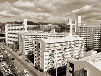 High angle view of buildings in city against sky