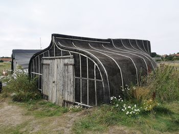 Fishermans hut constructed from an inverted boat. lindisfarne northumbria uk