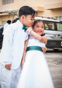 Portrait of happy friends standing outdoors