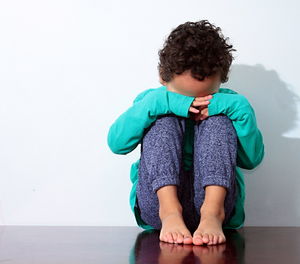 Little boy in poverty also praying and crying for food with no help stock photo