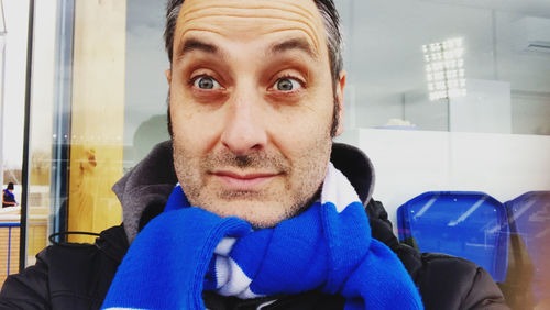 Portrait of smiling man sitting in bus